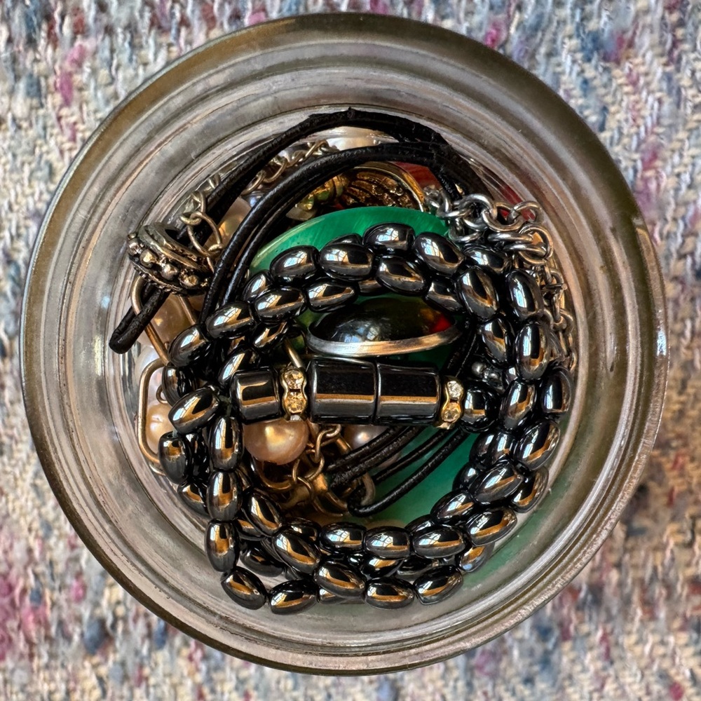 Jar filled with mystery costume jewelry.